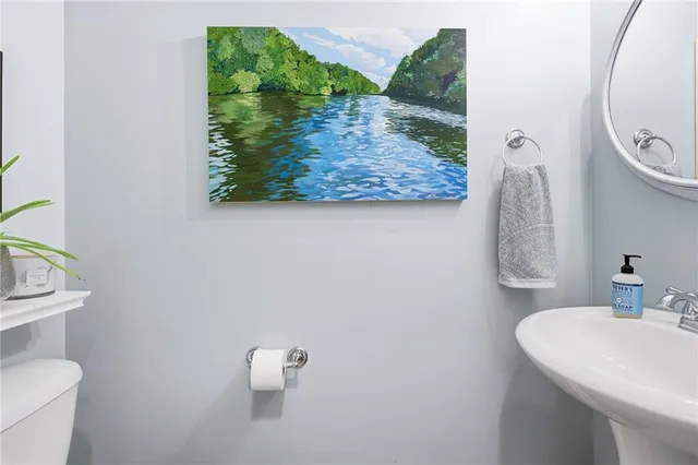 a bathroom with a double vanity sink mirror and shower