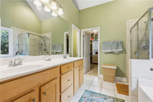 a view of walk in closet with clothes