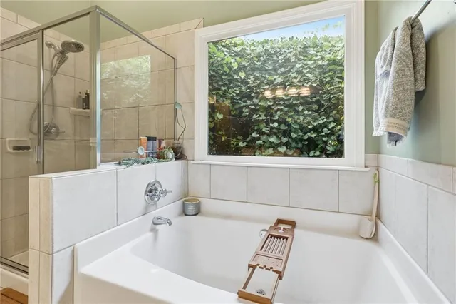 a living room with furniture potted plant and a window