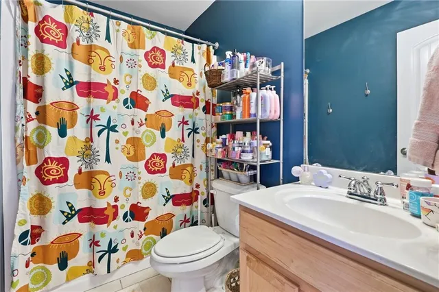 a bedroom with furniture a bed and a chandelier