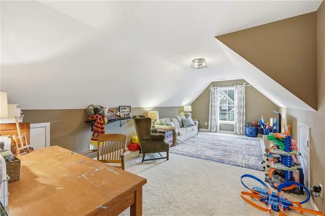 a bedroom with furniture and a window