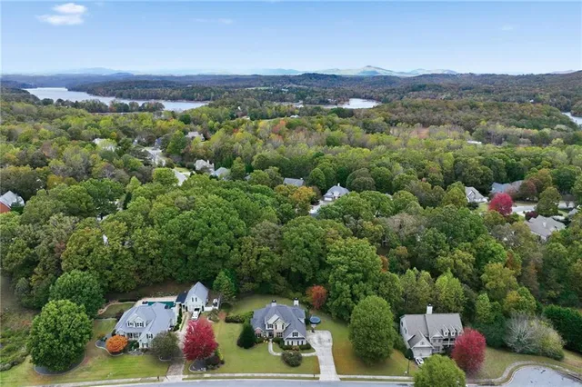 an aerial view of a house with a yard