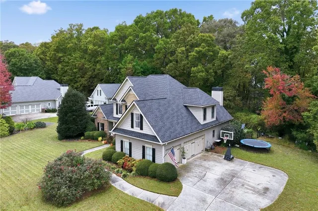 a living room with patio furniture and a floor to ceiling window