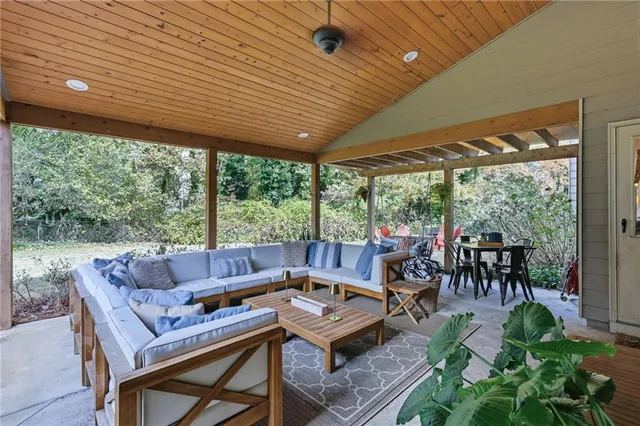 a front view of house with yard outdoor seating and barbeque oven