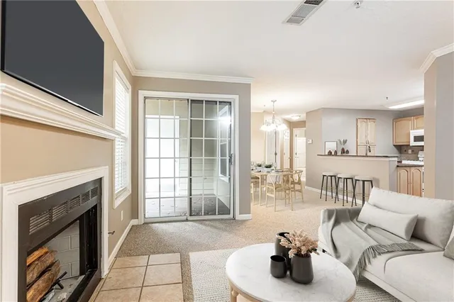 a living room with furniture and a fireplace