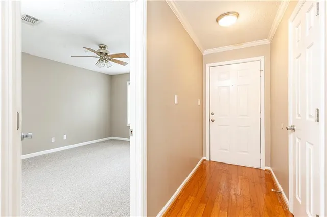 a view of room with a ceiling fan