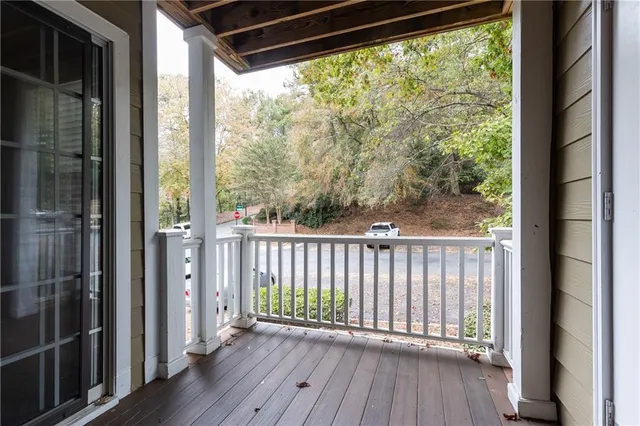 a view of a balcony with wooden floor