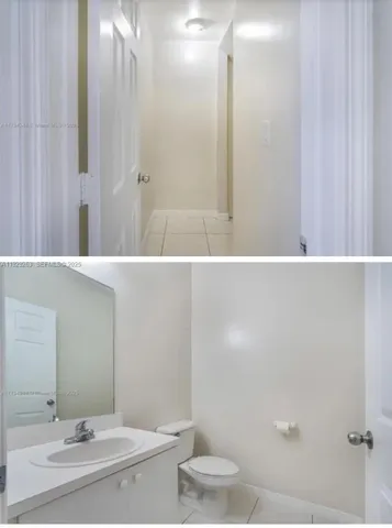 a bathroom with a sink and a washer dryer