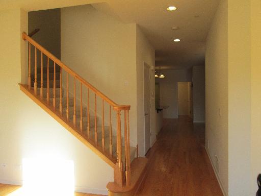 1956 Brentwood Road Northbrook, IL 60062 - Photo 11 of 16 a view of a hallway with wooden floor