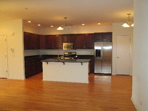 1956 Brentwood Road Northbrook, IL 60062 - Photo 5 of 16 a kitchen with stainless steel appliances granite countertop a refrigerator a sink a stove and a microwave