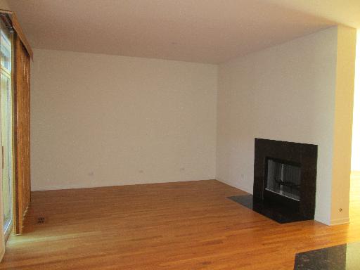 1956 Brentwood Road Northbrook, IL 60062 - Photo 10 of 16 a room with a bed and a fireplace