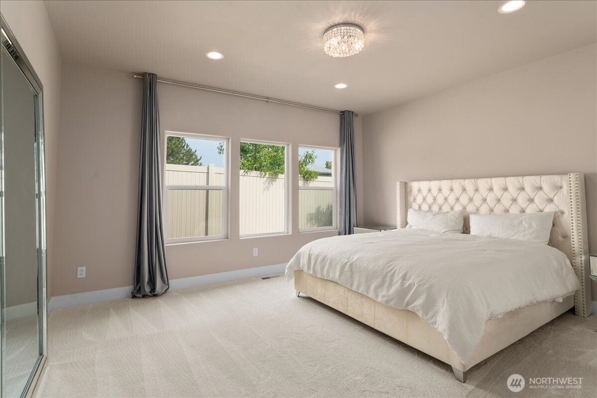 214 Solomon Loop Northwest East Wenatchee, WA 98802 - Photo 16 of 38 a large bed sitting in a room next to a window