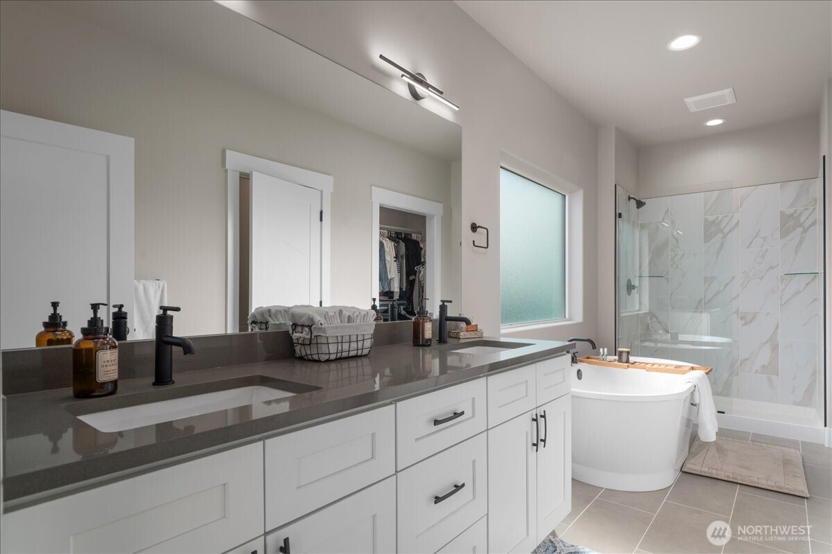 214 Solomon Loop Northwest East Wenatchee, WA 98802 - Photo 18 of 38 a bathroom with double sink and a mirror