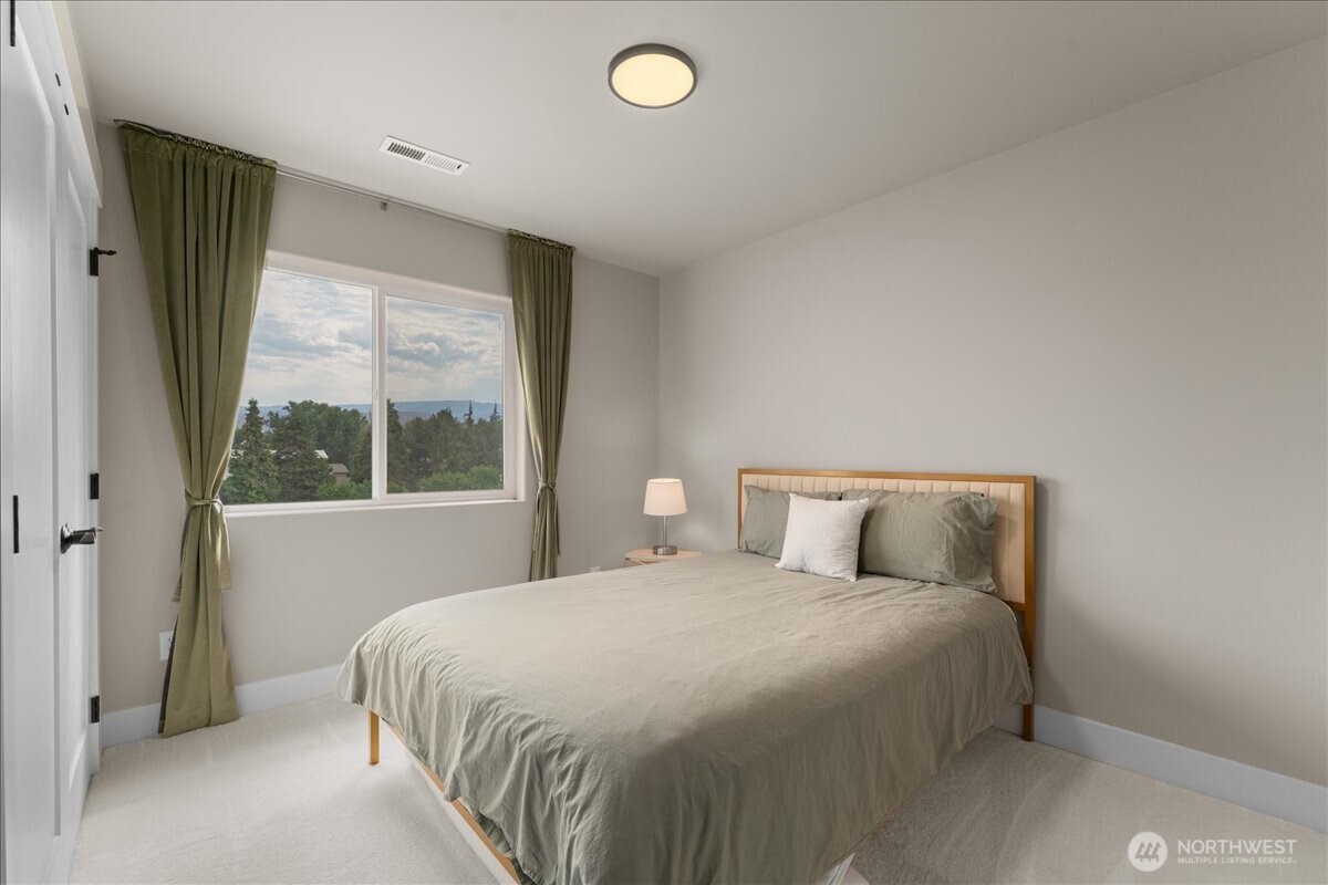 214 Solomon Loop Northwest East Wenatchee, WA 98802 - Photo 21 of 38 a bedroom with a bed and window