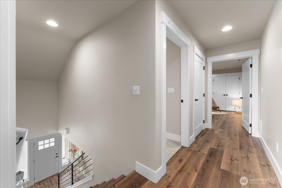 214 Solomon Loop Northwest East Wenatchee, WA 98802 - Photo 22 of 38 a view of a hallway with wooden floor and closet