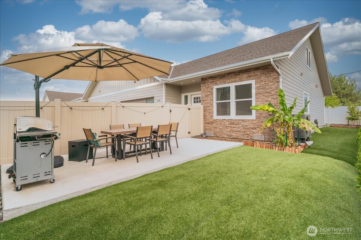 214 Solomon Loop Northwest East Wenatchee, WA 98802 - Photo 28 of 38 a view of a house with backyard and sitting area