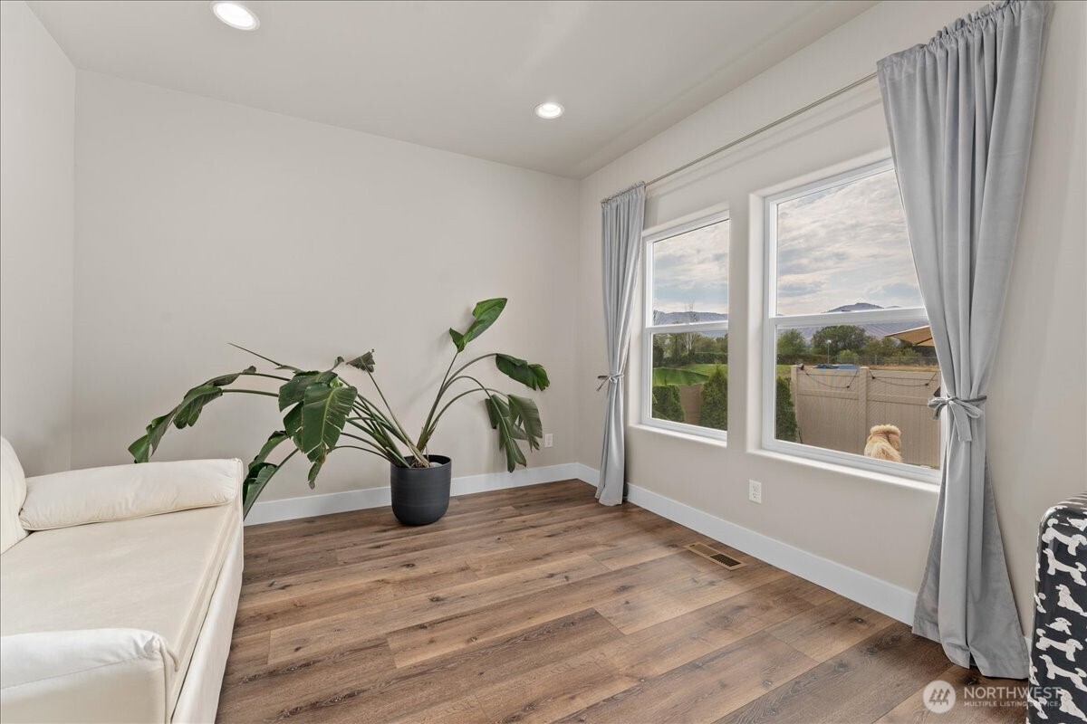 214 Solomon Loop Northwest East Wenatchee, WA 98802 - Photo 4 of 38 a living room with furniture and a wooden floor