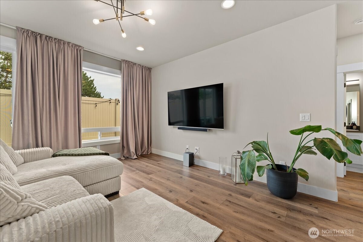 214 Solomon Loop Northwest East Wenatchee, WA 98802 - Photo 7 of 38 a living room with furniture and a flat screen tv