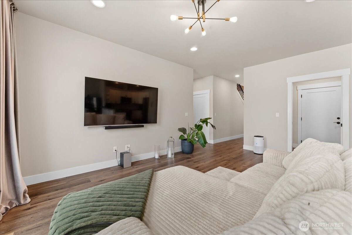 214 Solomon Loop Northwest East Wenatchee, WA 98802 - Photo 8 of 38 a bedroom with a bed and a flat screen tv