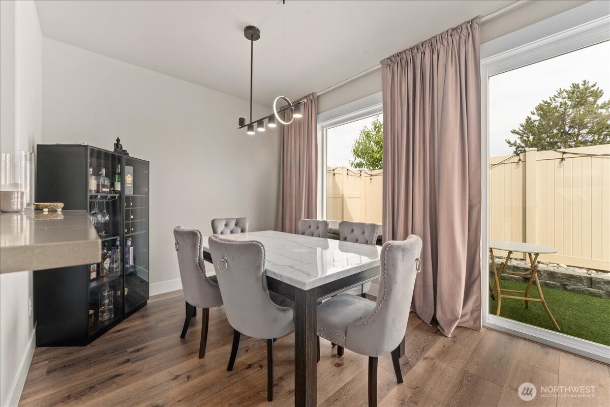 214 Solomon Loop Northwest East Wenatchee, WA 98802 - Photo 9 of 38 a view of a dining room with furniture window and outside view