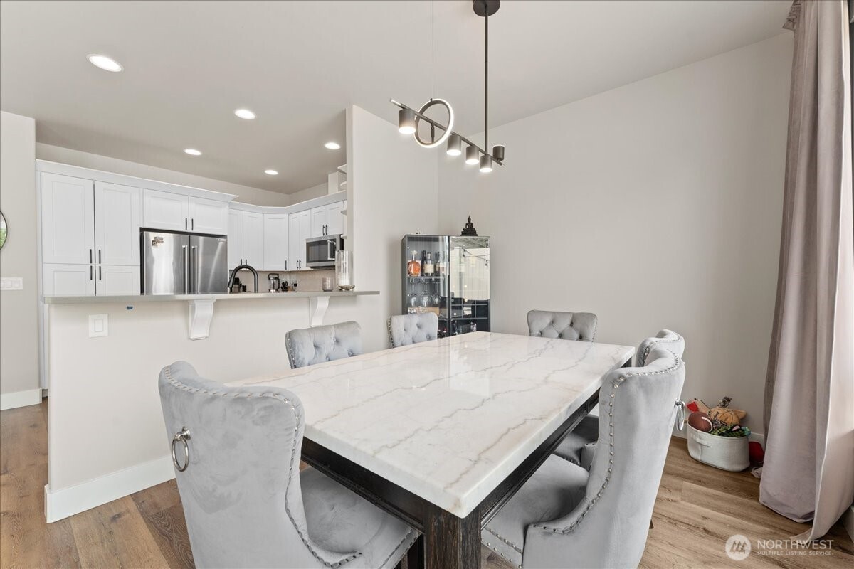 214 Solomon Loop Northwest East Wenatchee, WA 98802 - Photo 10 of 38 a view of kitchen and dining area with furniture