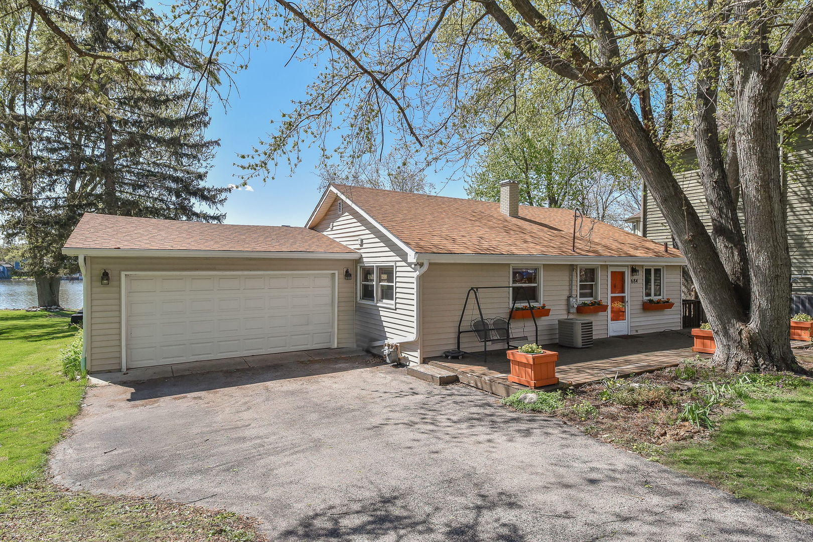 684 Robertson Road South Elgin, IL 60177 - Photo 1 of 18 a view of a house with a yard and large tree
