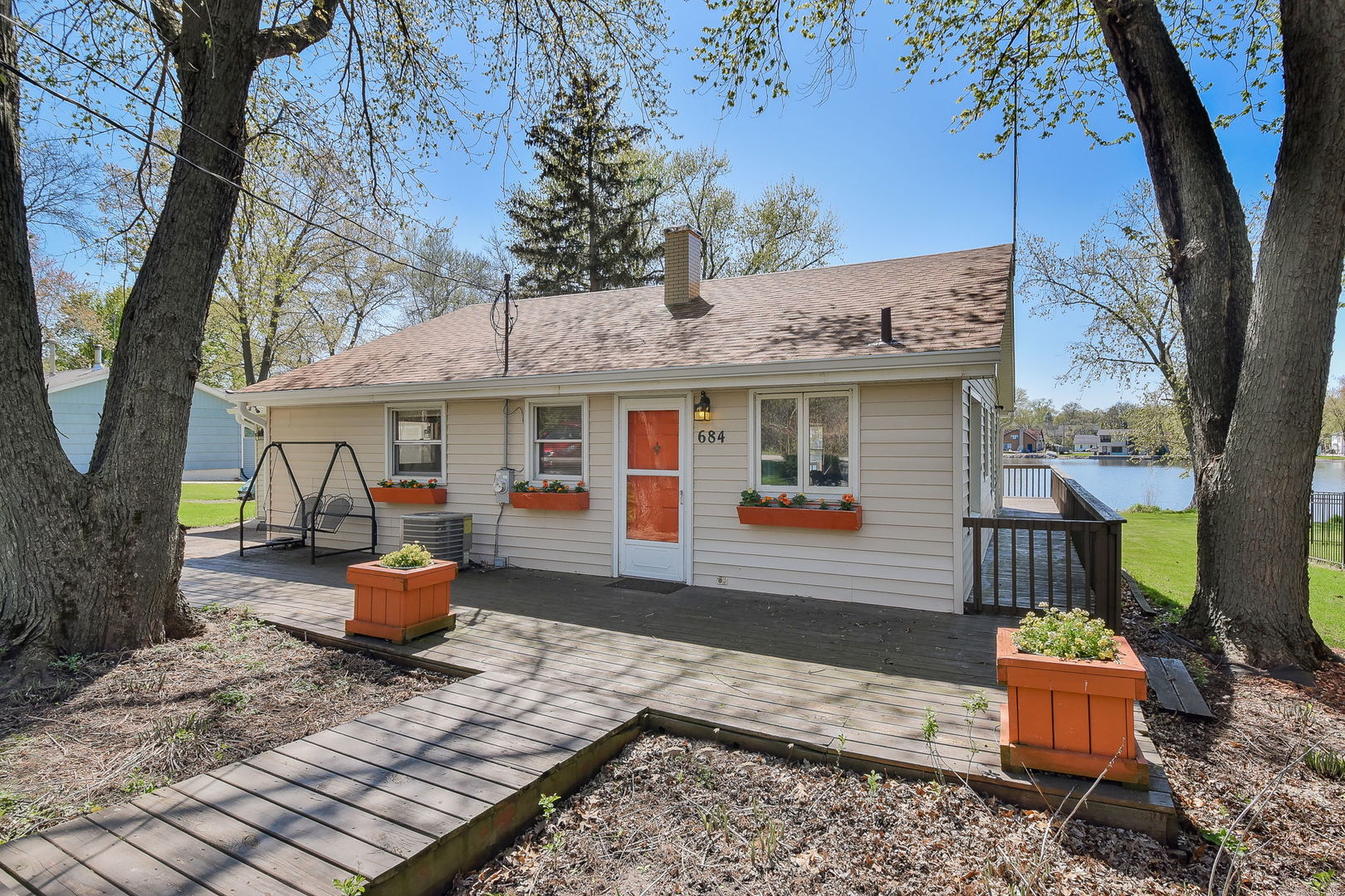 684 Robertson Road South Elgin, IL 60177 - Photo 2 of 18 a front view of a house with patio