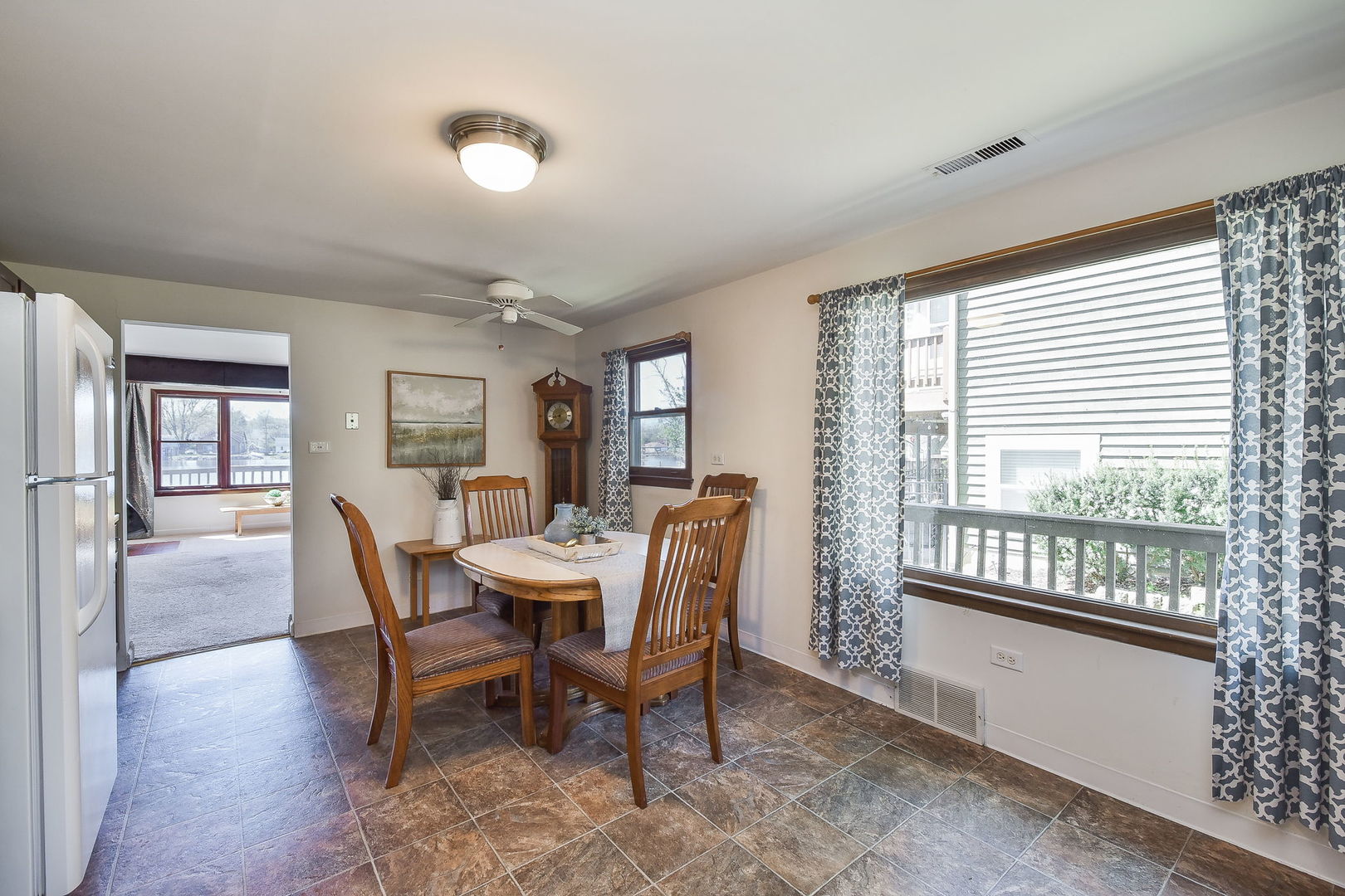 684 Robertson Road South Elgin, IL 60177 - Photo 5 of 18 a view of a dining room with furniture and a window