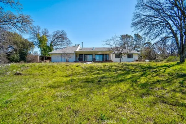 a view of a house with a big yard