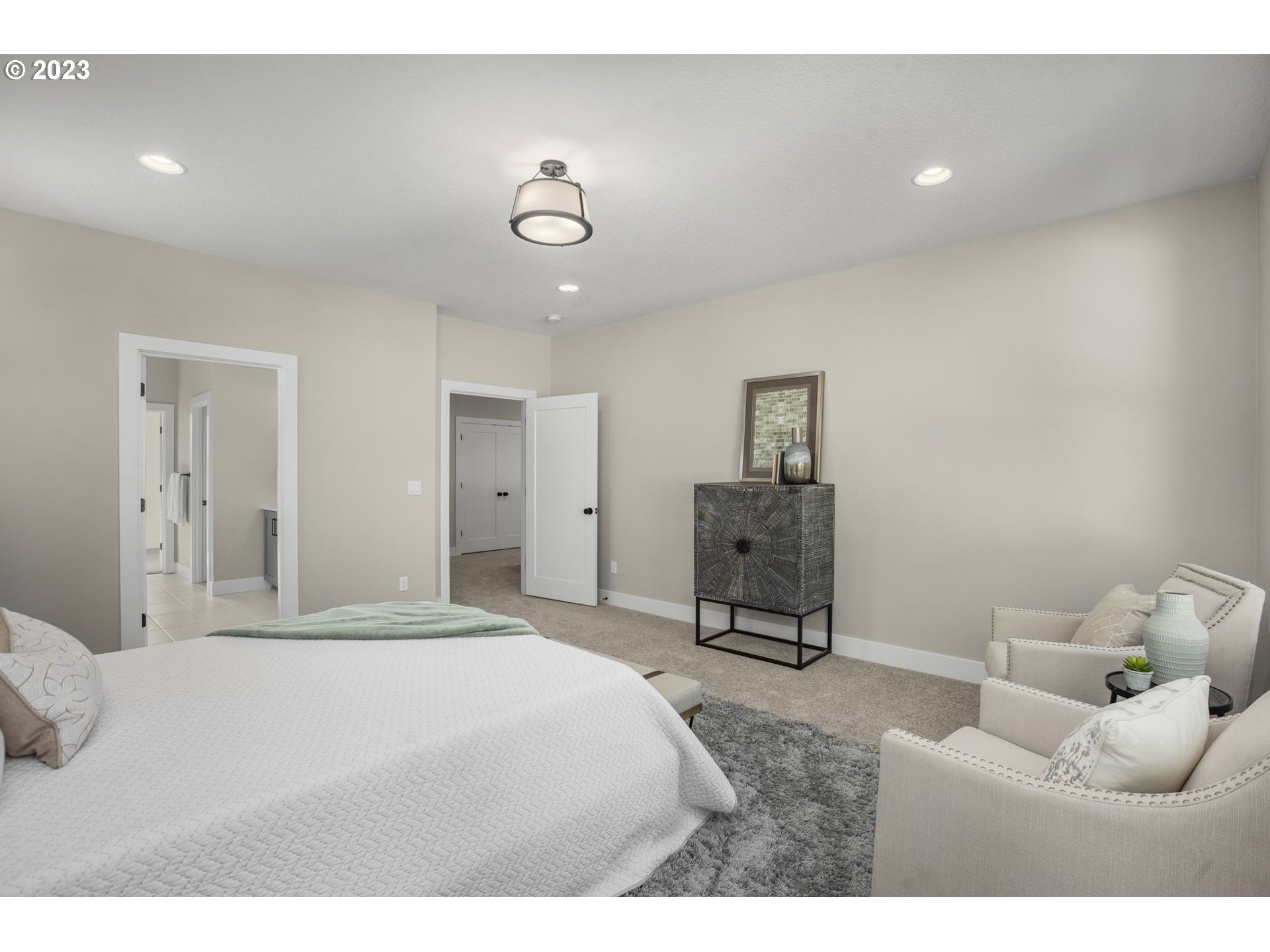 8878 Southwest Lintner Terrace Portland, OR 97223 - Photo 19 of 42 a bedroom with a bed and chair