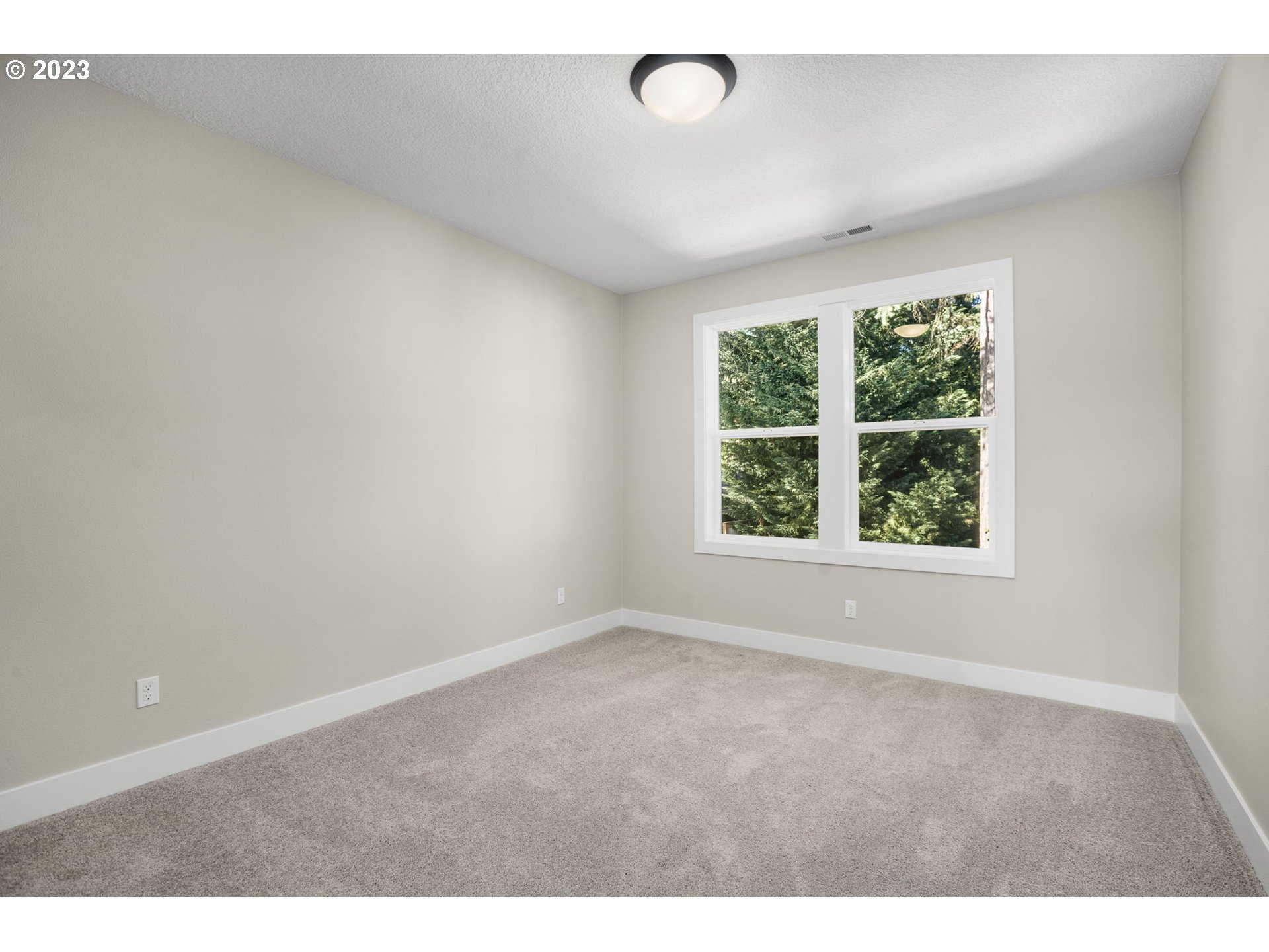 8878 Southwest Lintner Terrace Portland, OR 97223 - Photo 25 of 42 an empty room with an window