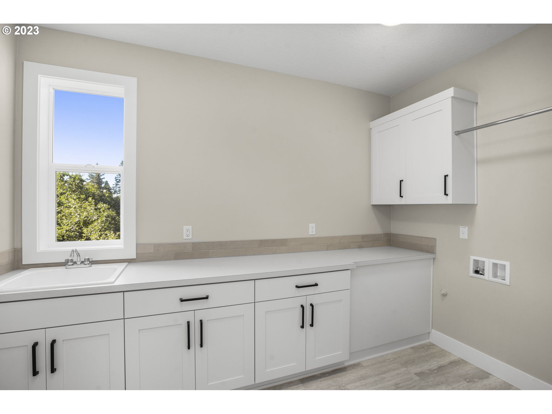 8878 Southwest Lintner Terrace Portland, OR 97223 - Photo 29 of 42 a bathroom with a sink and a window