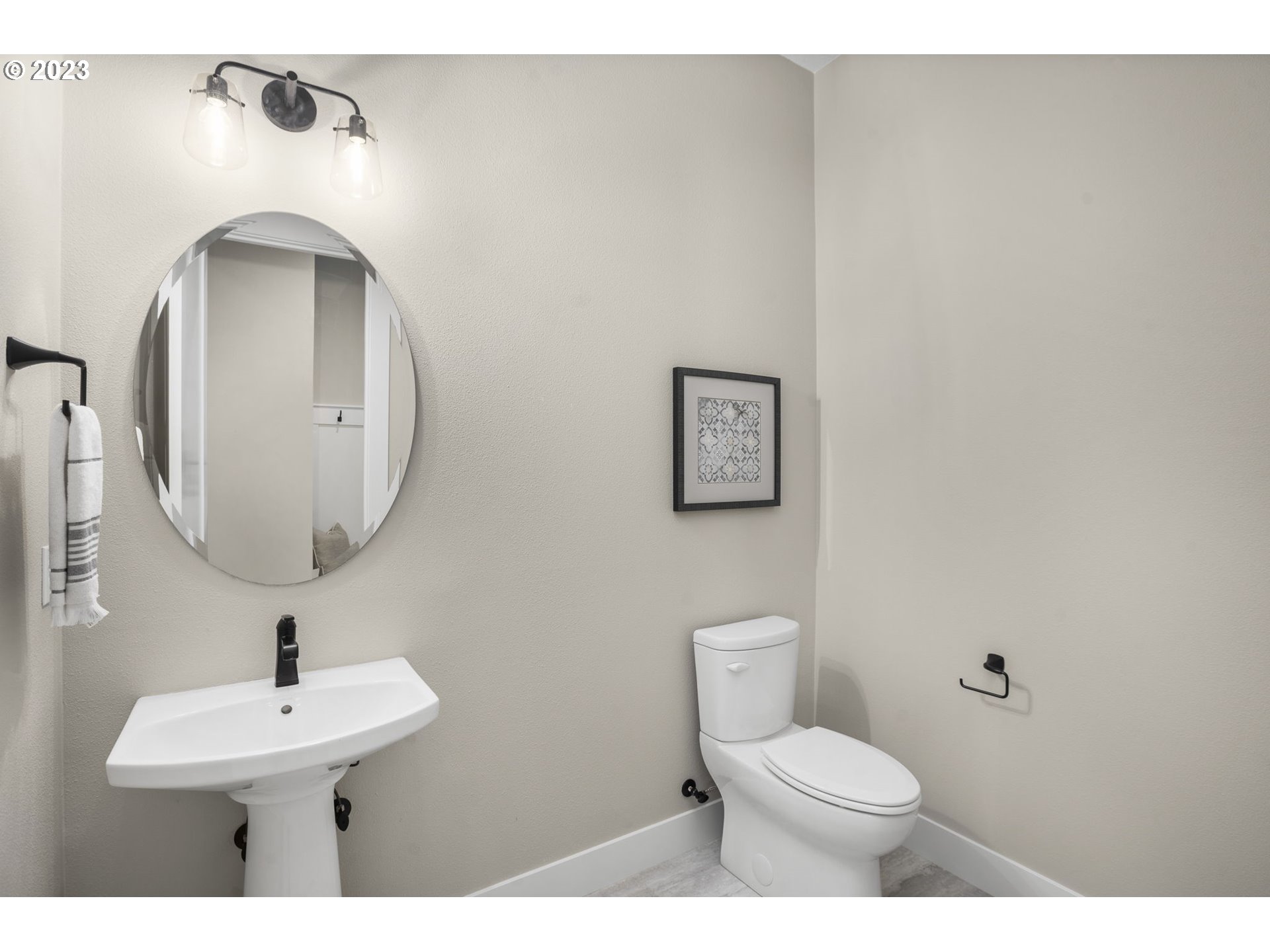 8878 Southwest Lintner Terrace Portland, OR 97223 - Photo 30 of 42 a bathroom with a toilet a sink and mirror