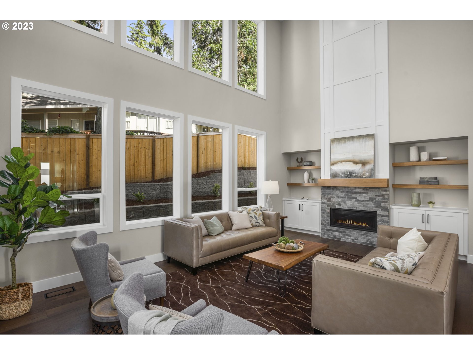 8878 Southwest Lintner Terrace Portland, OR 97223 - Photo 6 of 42 a living room with furniture fireplace and potted plants