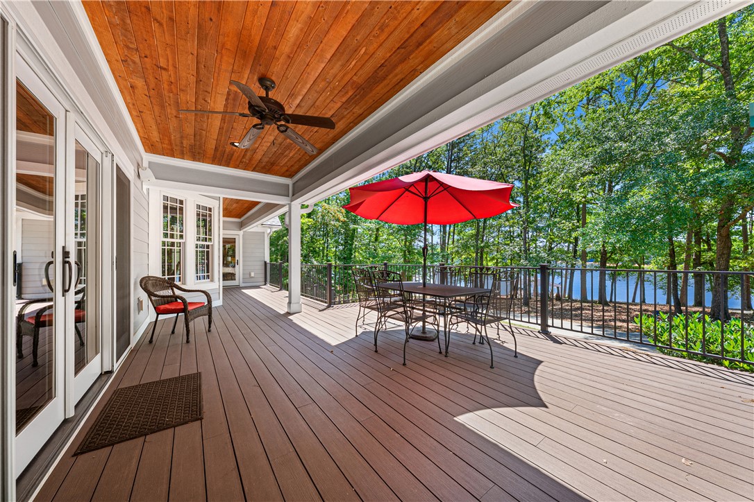 285 Bertha Allen Road Westminster, SC 29693 - Photo 28 of 50 A spacious outdoor deck with wood planking offers serene lakefront views, ideal for relaxation.