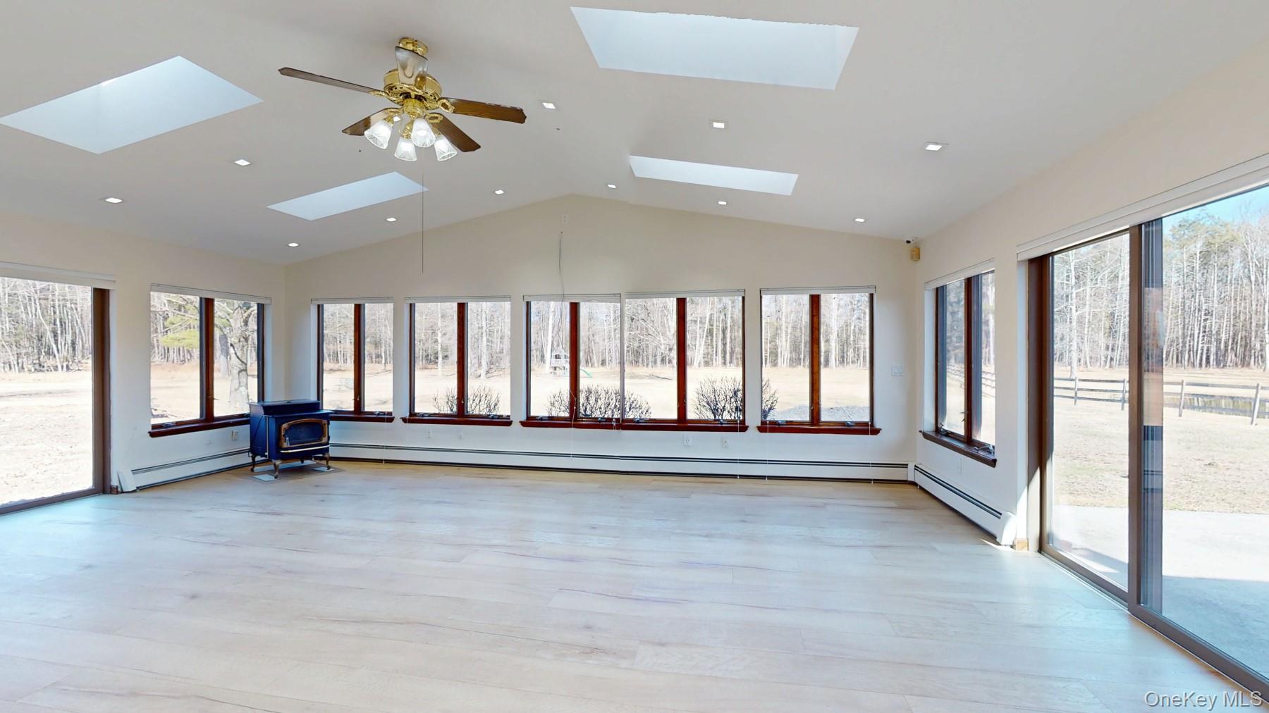 565 Prosperous Valley Road Middletown, NY 10940 - Photo 20 of 47 an empty room with windows and ceiling fan