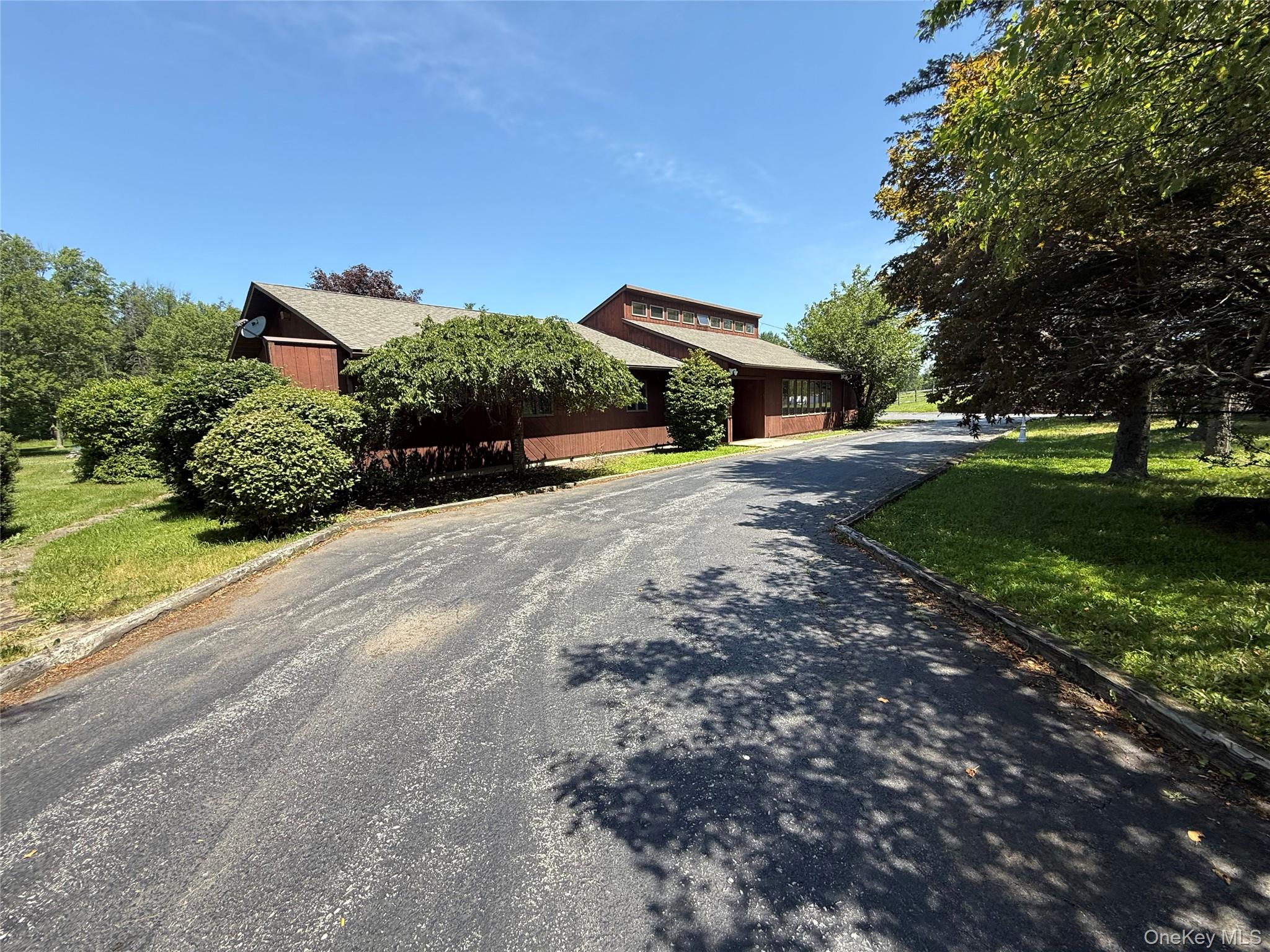 565 Prosperous Valley Road Middletown, NY 10940 - Photo 2 of 47 a front view of a house with a yard and garage