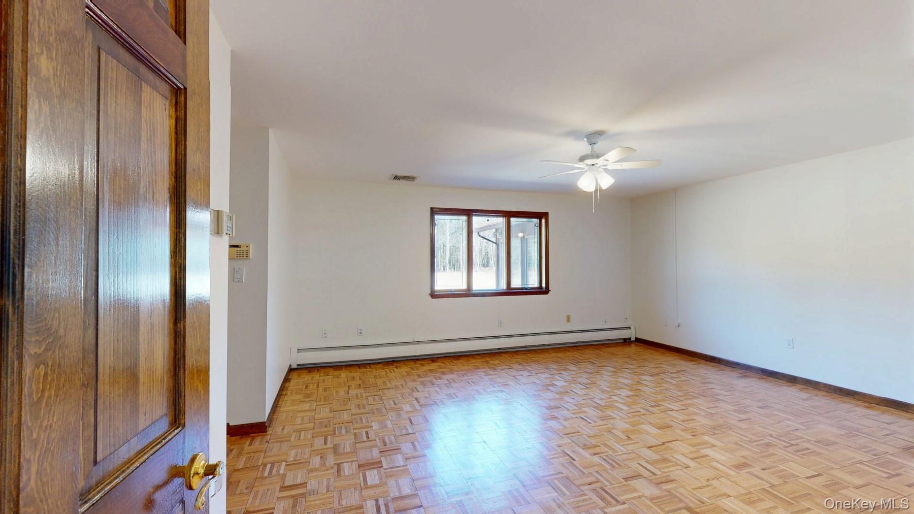 565 Prosperous Valley Road Middletown, NY 10940 - Photo 30 of 47 a view of an empty room with wooden floor and a window