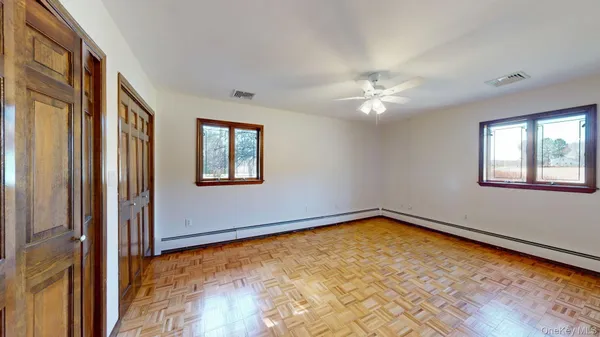a view of a livingroom with a chandelier fan