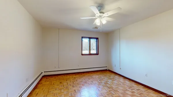 a view of an empty room with a window