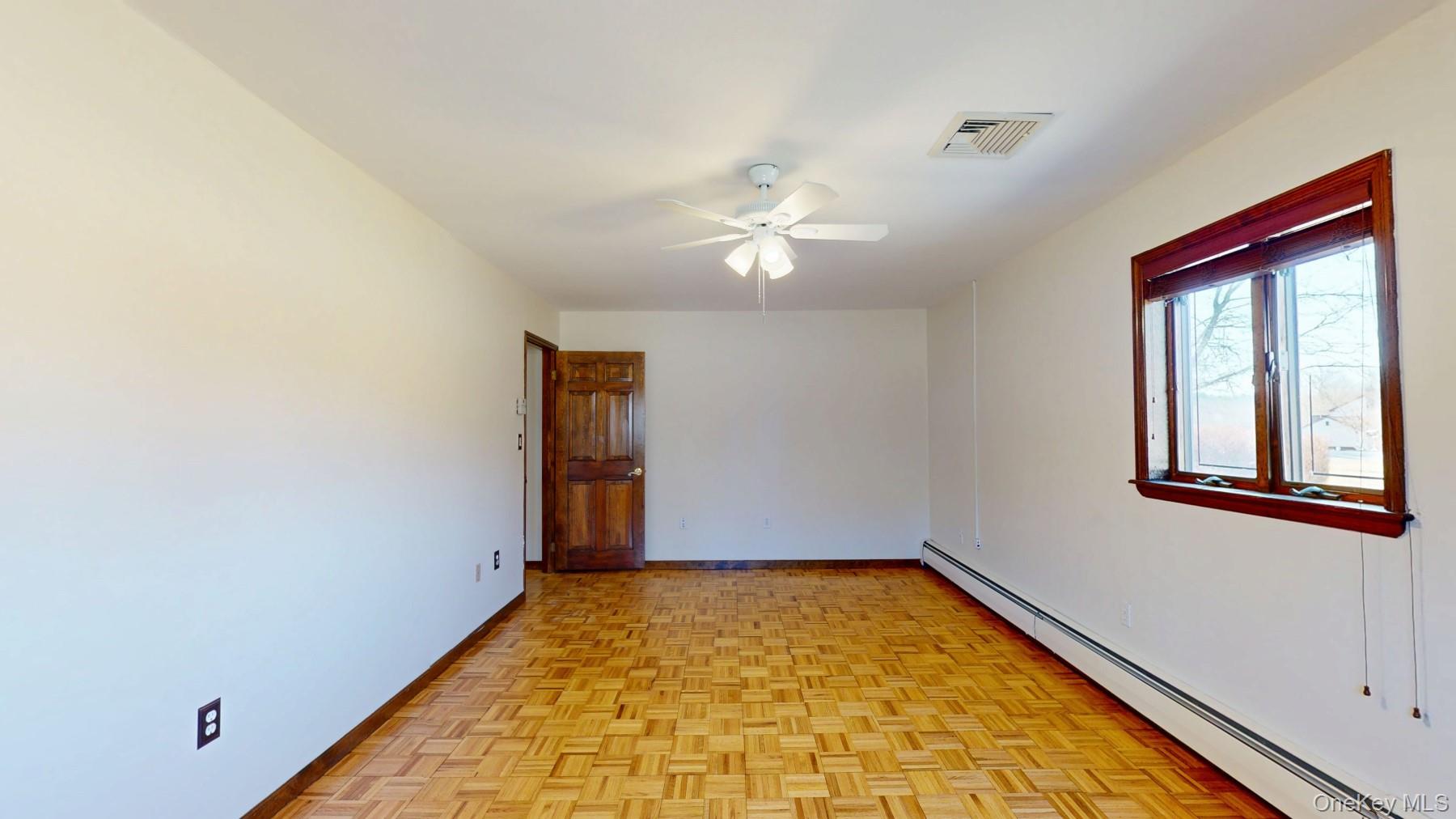 565 Prosperous Valley Road Middletown, NY 10940 - Photo 41 of 47 wooden floor in an empty room with a window