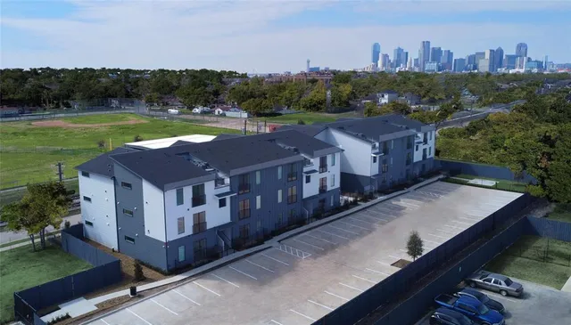 a aerial view of a house with a yard