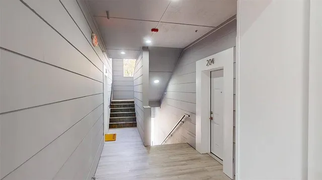 a view of a hallway view with staircase