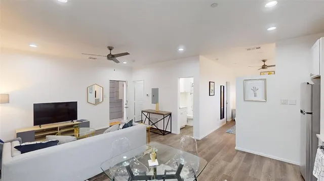 a bedroom with furniture and a flat screen tv