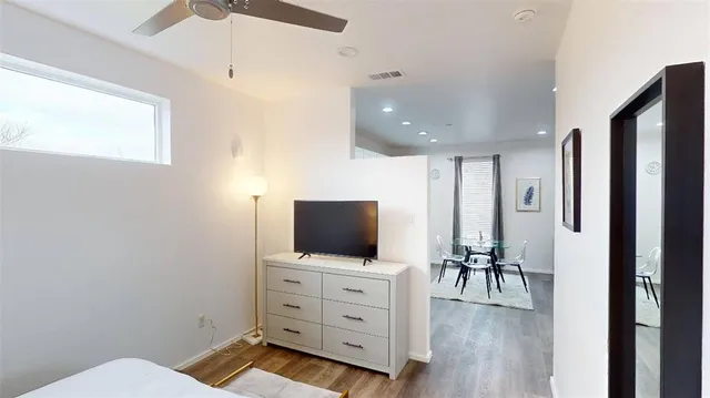 a living room with furniture and flat screen tv