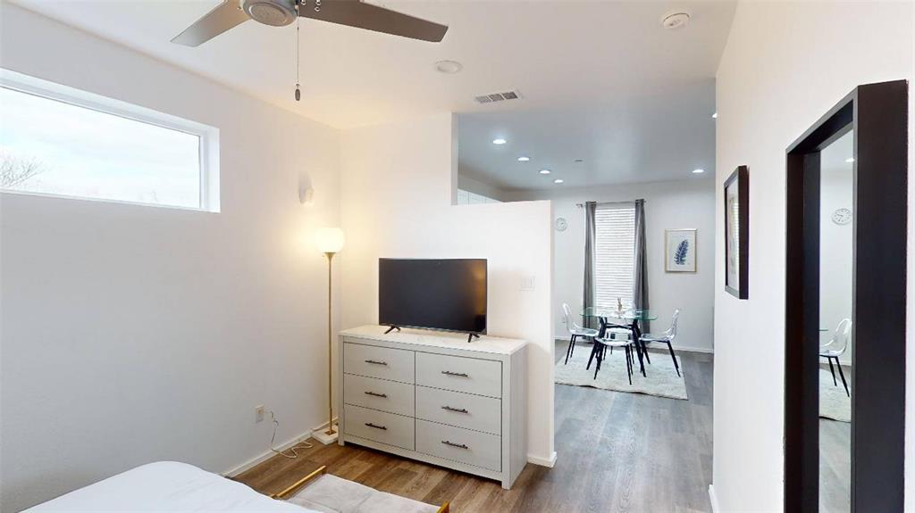 3235 Dallas Street, Unit 1201 Dallas, TX 75210 - Photo 8 of 26 a living room with furniture and flat screen tv