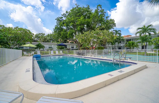 a view of a swimming pool with a balcony