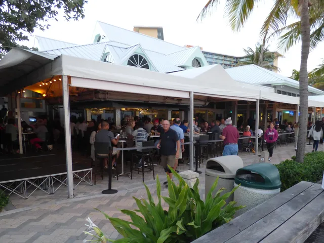 a building outdoor space with patio furniture and dining space