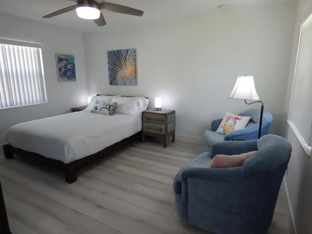 a bedroom with bed and a window