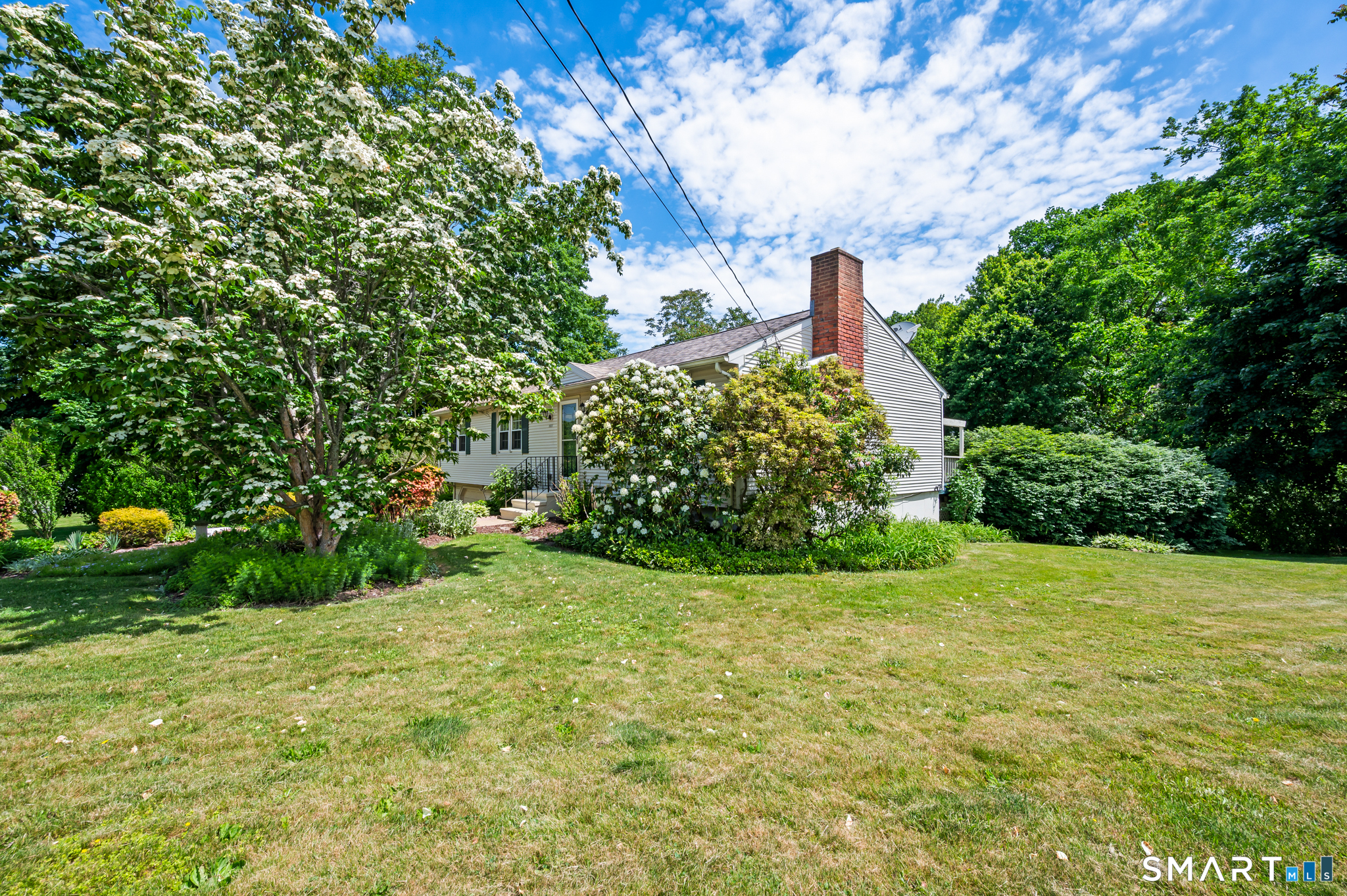 1611 Shepard Avenue Hamden, CT 06518 - Photo 4 of 31 a view of a garden with a fountain